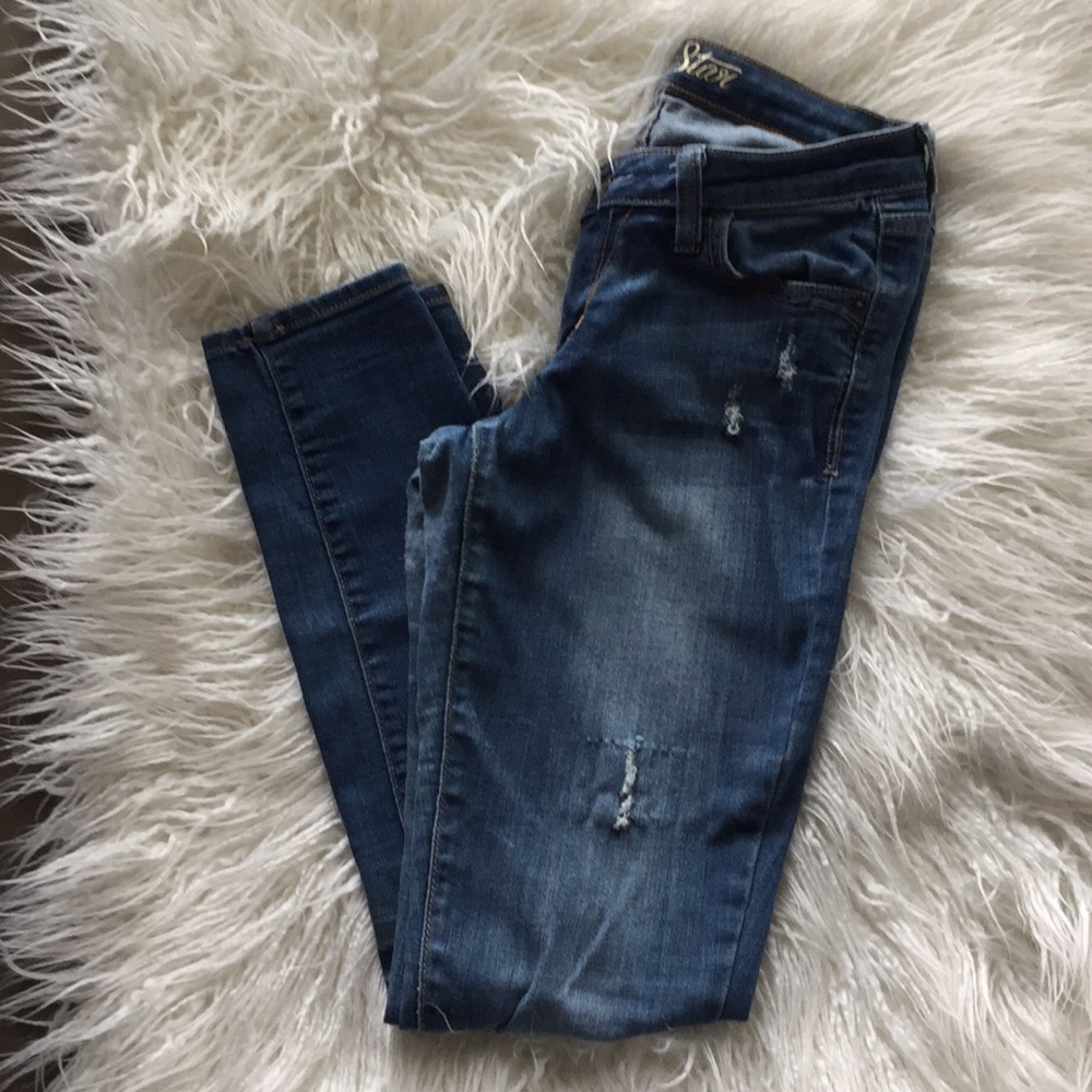 Medium wash distressed skinny jeans